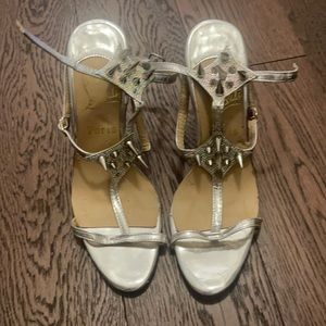 Christian Loubutin silver red bottoms with spikes
